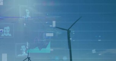 Animation of statistical data processing and profile icons against spinning windmills on grasslands. Renewable energy and business data technology concept