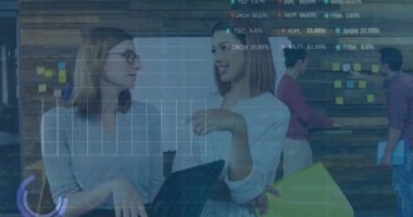 Animation of stock market data processing over two diverse women discussing at office. Global economy and business technology concept