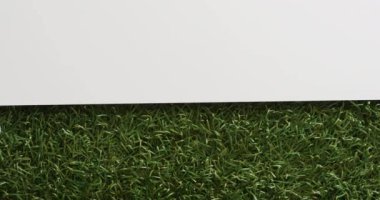 Close up of golf ball on grass with white background, copy space, slow motion. Golf, sport and hobby concept.