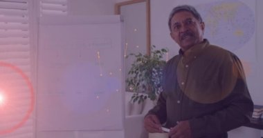 Animation of network of connections over biracial male teacher pointing at whiteboard. Global education, learning and digital interface concept digitally generated video.