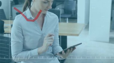 Animation of financial data processing with red line over caucasian businesswoman using tablet. Global business, finances, computing and data processing concept digitally generated video.