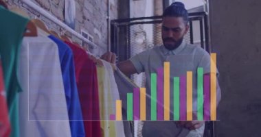 Animation of data processing over biracial male designer. Global business, finances and digital interface concept digitally generated video.