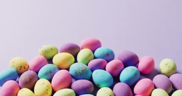 Multiple Colorful Easter Eggs Purple Background Copy Space Easter Tradition — 图库视频影像