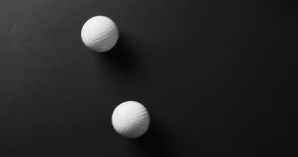 Close Golf Balls Black Background Copy Space Slow Motion Golf — Stockvideo