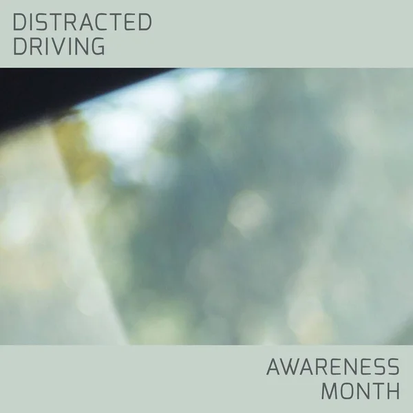Composition of distracted driving awareness month text over blurred background. Distracted driving awareness month and celebration concept digitally generated image.