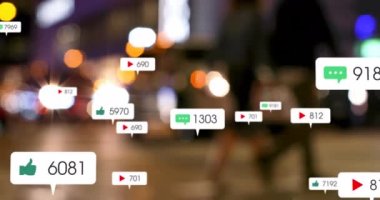 Animation of notification icons with increasing numbers over people walking in illuminated city. Digital composite, multiple exposure, message, play, like, number, light beam, technology.