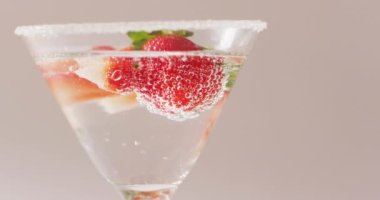 Close up of drink with sugar and strawberries on white background. Cocktail day, party and celebration concept.