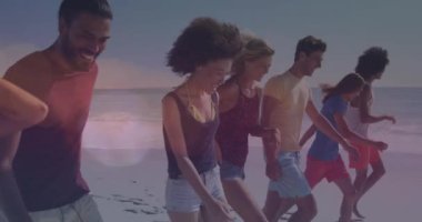 Animation of lens flares over diverse young friends walking at beach during sunny day. Digital composite, cheerful, togetherness, nature, illuminated, enjoyment and vacations concept.
