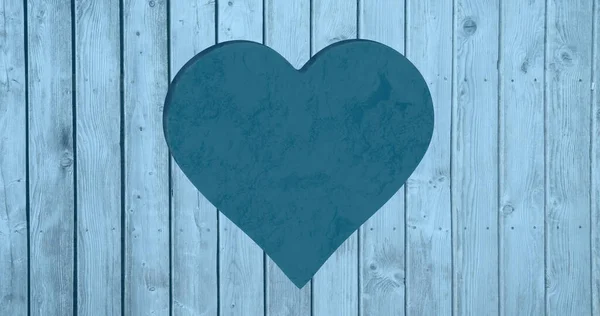 Composite of blue heart cut out in blue wooden boards and copy space. Valentine\'s day, love, celebration concept digitally generated image.