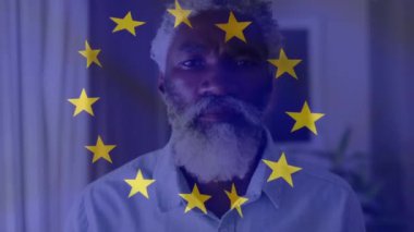 Animation of flag of eu over senior african american man. Politics and patriotism concept digitally generated video.