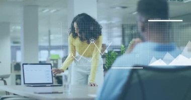 Animation of financial data processing over diverse business people working in office. Global business, finances, computing and data processing concept digitally generated video.