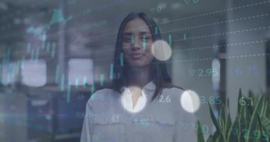 Animation of financial data processing over biracial businesswoman. Global business, finances, computing and data processing concept digitally generated video.