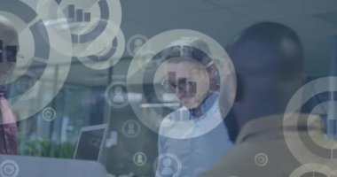 Animation of financial data processing over diverse business people in office. Global business, finances, computing and data processing concept digitally generated video.