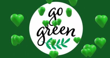 Animation of green hearts over go green text on green background. Valentine's day, love and celebration concept digitally generated video.