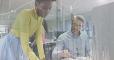 Animation of financial data processing over diverse business people in office. Global business, finances, computing and data processing concept digitally generated video.