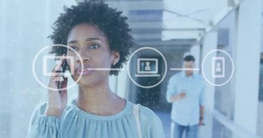 Animation of data processing over biracial businesswoman using smartphone in airport. Global business, finances, computing and data processing concept digitally generated video.