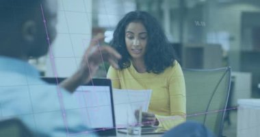 Animation of financial data processing over diverse business people working in office. Global business, finances, computing and data processing concept digitally generated video.