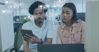 Animation of financial data processing over diverse business people in office. Global business, finances, computing and data processing concept digitally generated video.