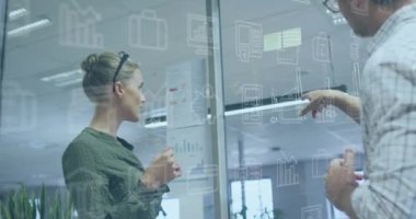 Animation of icons and financial data processing over diverse business people in office. Global business, finances, computing and data processing concept digitally generated video.