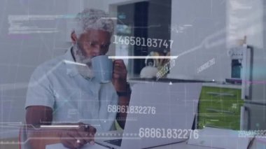 Animation of data processing over african american man using laptop. Global business, digital interface, computing and data processing concept digitally generated video.