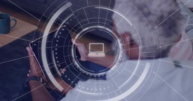 Animation of data processing over african american man using tablet. Global business, digital interface, computing and data processing concept digitally generated video.