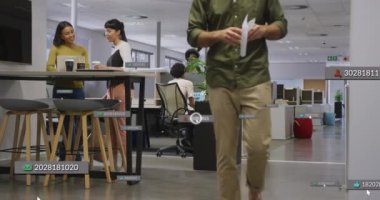 Animation of financial data processing over diverse business people in office. Global business, finances, computing and data processing concept digitally generated video.