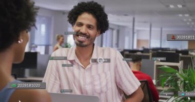 Animation of financial data processing over diverse business people in office. Global business, finances, computing and data processing concept digitally generated video.