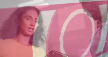 Animation of data processing text over diverse business people working in office. Global business, finances, computing and data processing concept digitally generated video.