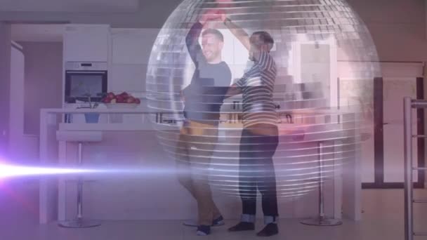 Animation Disco Ball Light Trails Diverse Male Couple Dancing Kitchen — Stock Video