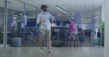 Animation of financial data processing over biracial businessman using vr headset. Global business, finances, computing and data processing concept digitally generated video.