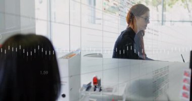 Female executives interacting with each other in an office setting. Global business digital interface technology and networking concept digitally generated video.