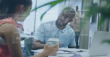 Animation of financial data processing over diverse business people in office. Global business, finances, computing and data processing concept digitally generated video.