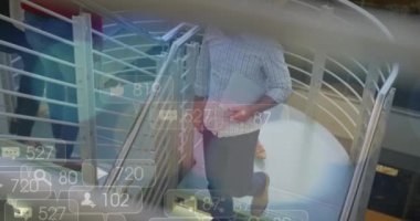 Animation of financial data processing over diverse business people in office. Global business, finances, computing and data processing concept digitally generated video.