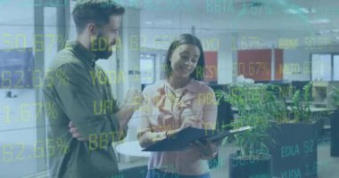 Animation of financial data processing over diverse business people in office. Global business, finances, computing and data processing concept digitally generated video.