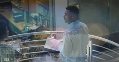 Animation of financial data processing over diverse business people in office. Global business, finances, computing and data processing concept digitally generated video.