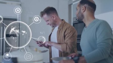 Animation of globe with data processing over diverse men using tablet. Global business, digital interface, computing and data processing concept digitally generated video.