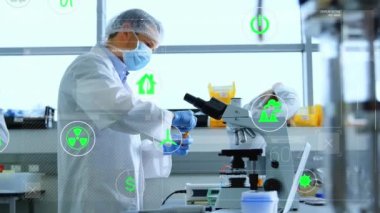 A male scientist is shown experimenting in a laboratory with various energy and power-related technology. Global security research and safety concept digitally generated image.
