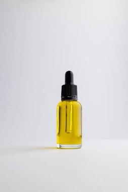 Image of glass bottle with pump and copy space on white background. Plastic free beauty, health and beauty, sustainability concept.