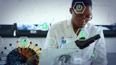 Animation of shapes and ecology icons over african american female scientist in lab. Global science and digital interface concept digitally generated video.