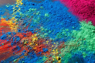 Close up of multi coloured powder with copy space. Holi festival, colour, hindu tradition and celebration concept.