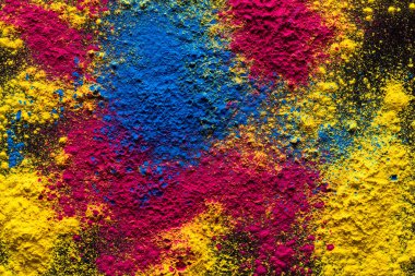 Close up of multi coloured powder with copy space. Holi festival, colour, hindu tradition and celebration concept.