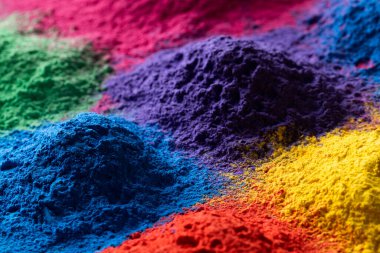 Close up of multi coloured powder with copy space. Holi festival, colour, hindu tradition and celebration concept.