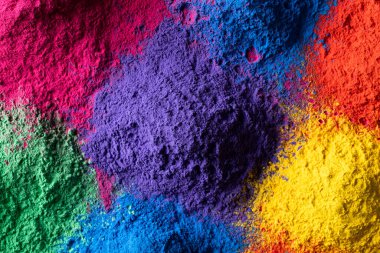 Close up of multi coloured powder with copy space. Holi festival, colour, hindu tradition and celebration concept.