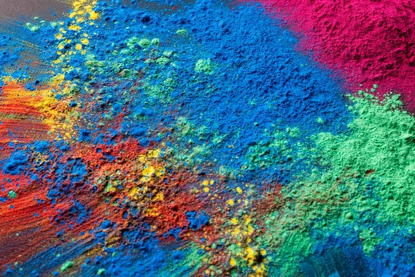 Close up of multi coloured powder with copy space. Holi festival, colour, hindu tradition and celebration concept.