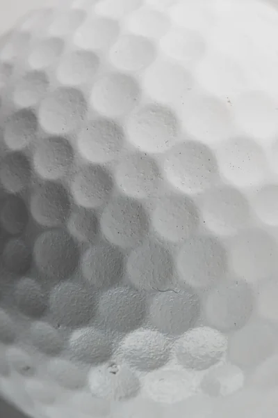 Close up of white golf ball with pattern and detail and copy space. Golf, sports and competition concept.