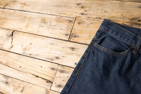 Dark Blue Jeans Lying Wooden Surface Clothes Fashion Design Fabrics — Stock Photo, Image