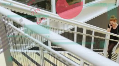 Animation of data processing over caucasian woman talking on smartphone while climbing stairs. Business data technology concept
