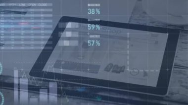 Animation of statistical data processing over digital tablet on office table. Business data technology concept
