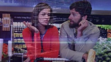 Animation of financial data processing over caucasian couple arguing at a grocery store. Global finance and retail business concept