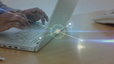 Animation of network of connections over biracial businessman using laptop. Global business, finances, computing and data processing concept digitally generated video.